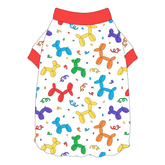 Tee shirt style with flutter hem in a dog friendly pattern that shows party images like balloons and confetti. It's complete with solid red trim on the neck and sleeves.